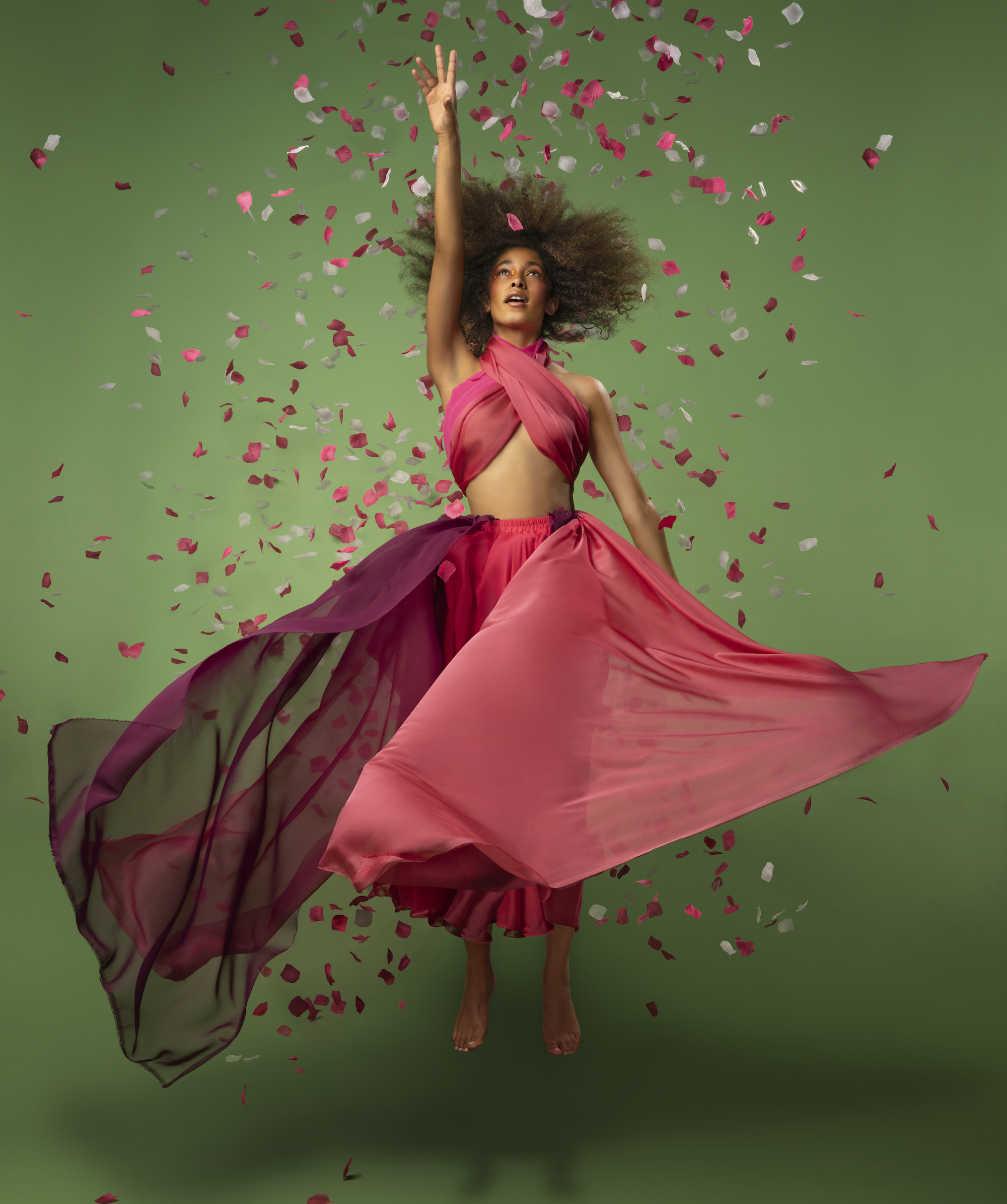 Editorial photography in motion against a saturated green backdrop